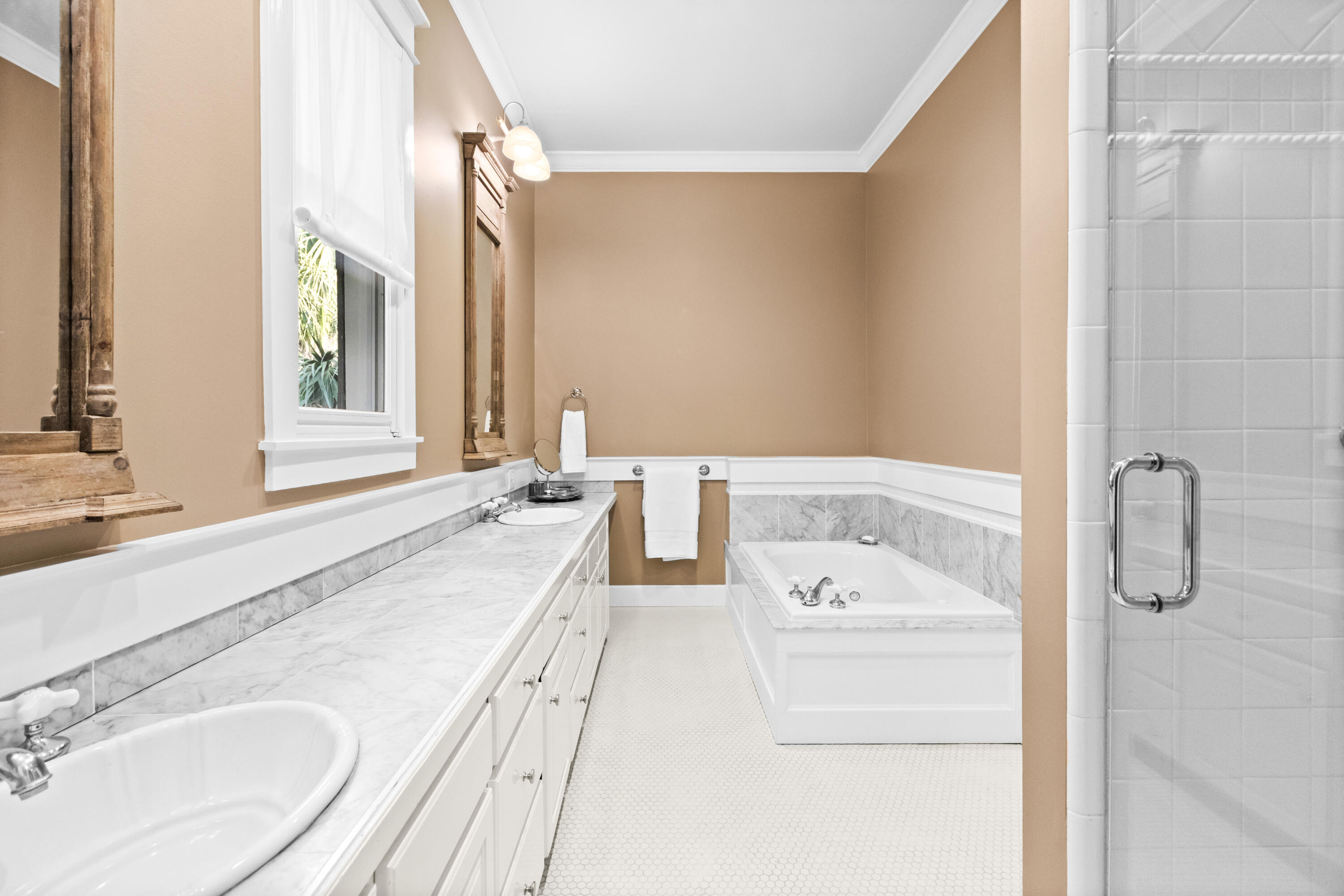 89 Sienna Court Santa Rosa Beach, FL 32459 - Photo 24 of 65 a spacious bathroom with a granite countertop sink and a mirror