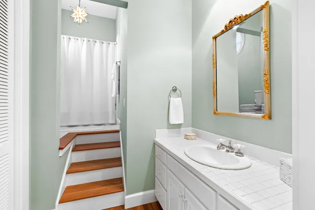 a living room with furniture and floor to ceiling windows