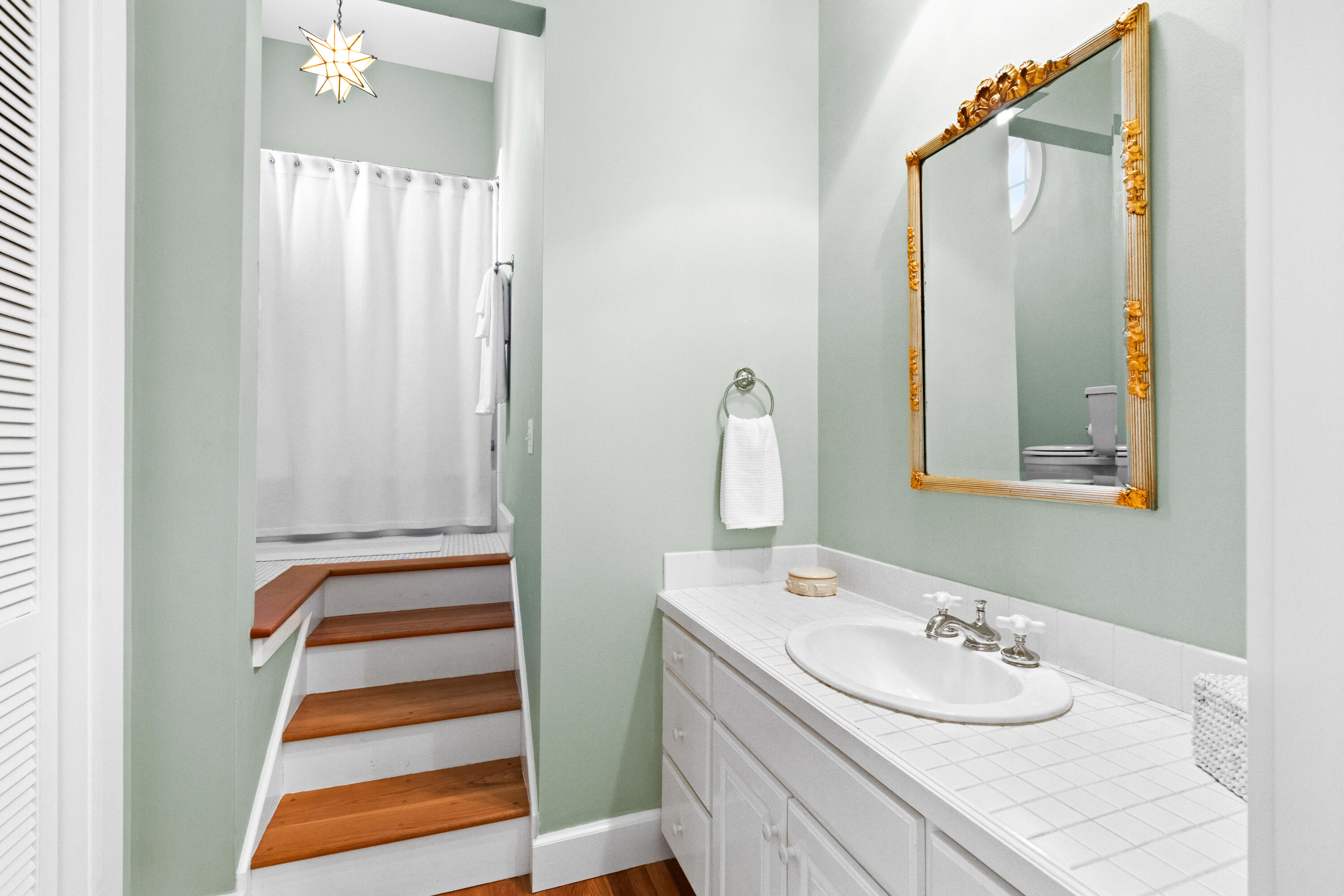 89 Sienna Court Santa Rosa Beach, FL 32459 - Photo 32 of 65 a bathroom with a sink and a mirror