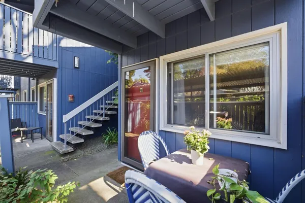 a view of two chairs in the balcony