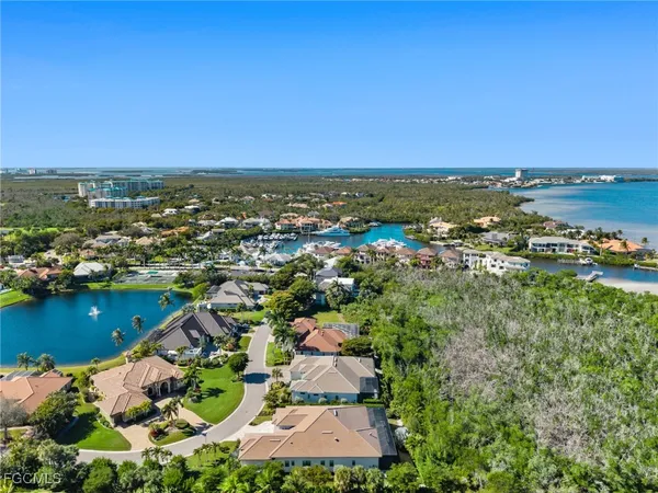 an aerial view of a city with ocean view