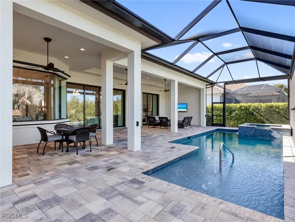 a lobby with furniture and a table