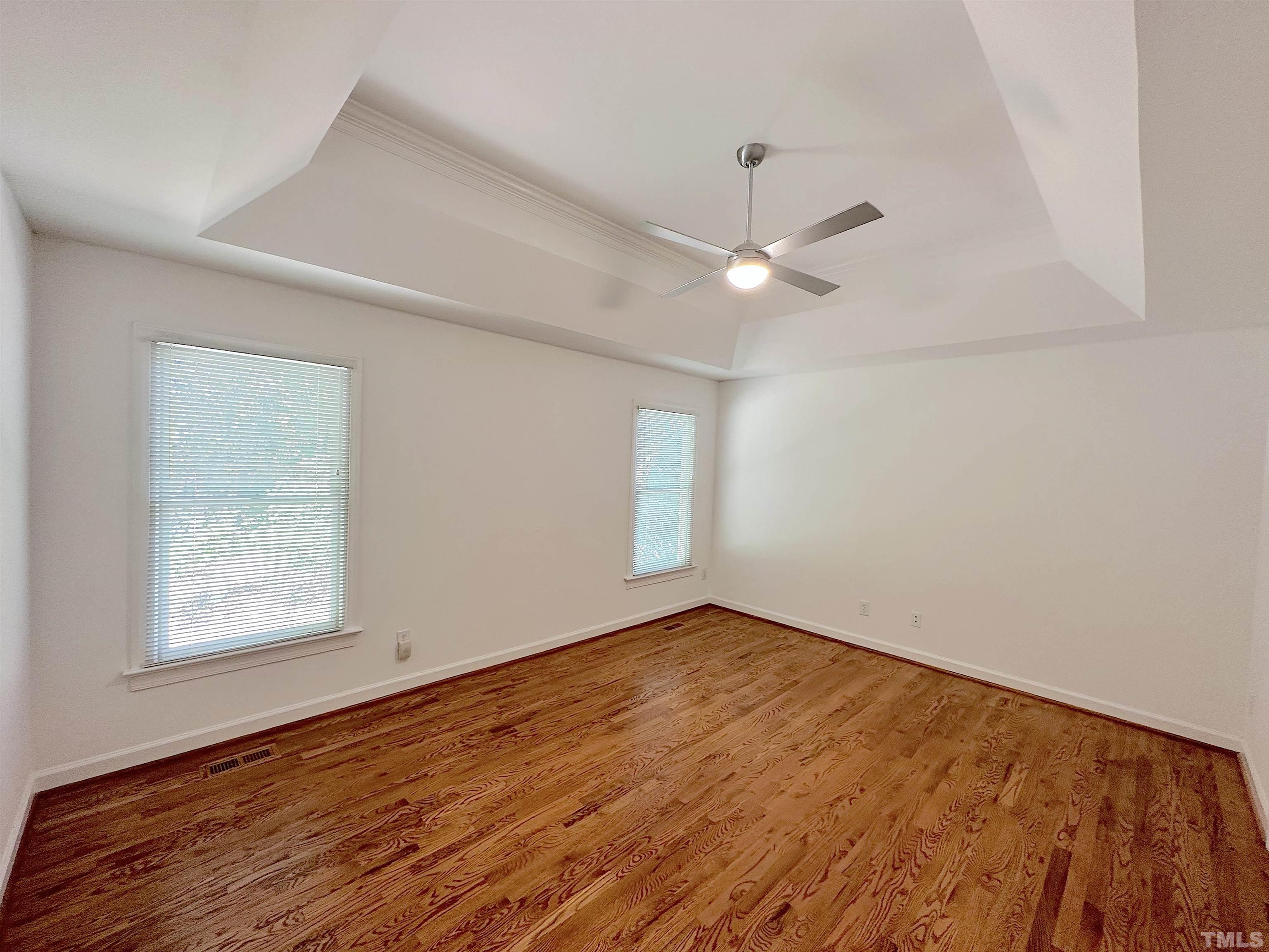 105 Wagon Trail Drive Cary, NC 27513 - Photo 11 of 22 wooden floor in an empty room with a window