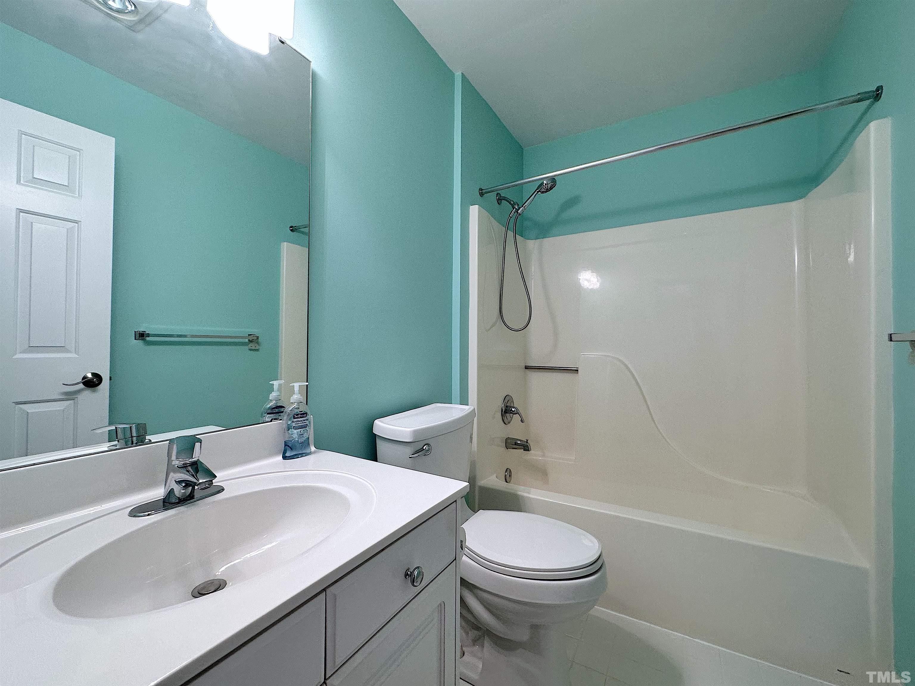 105 Wagon Trail Drive Cary, NC 27513 - Photo 17 of 22 a bathroom with a sink toilet and shower