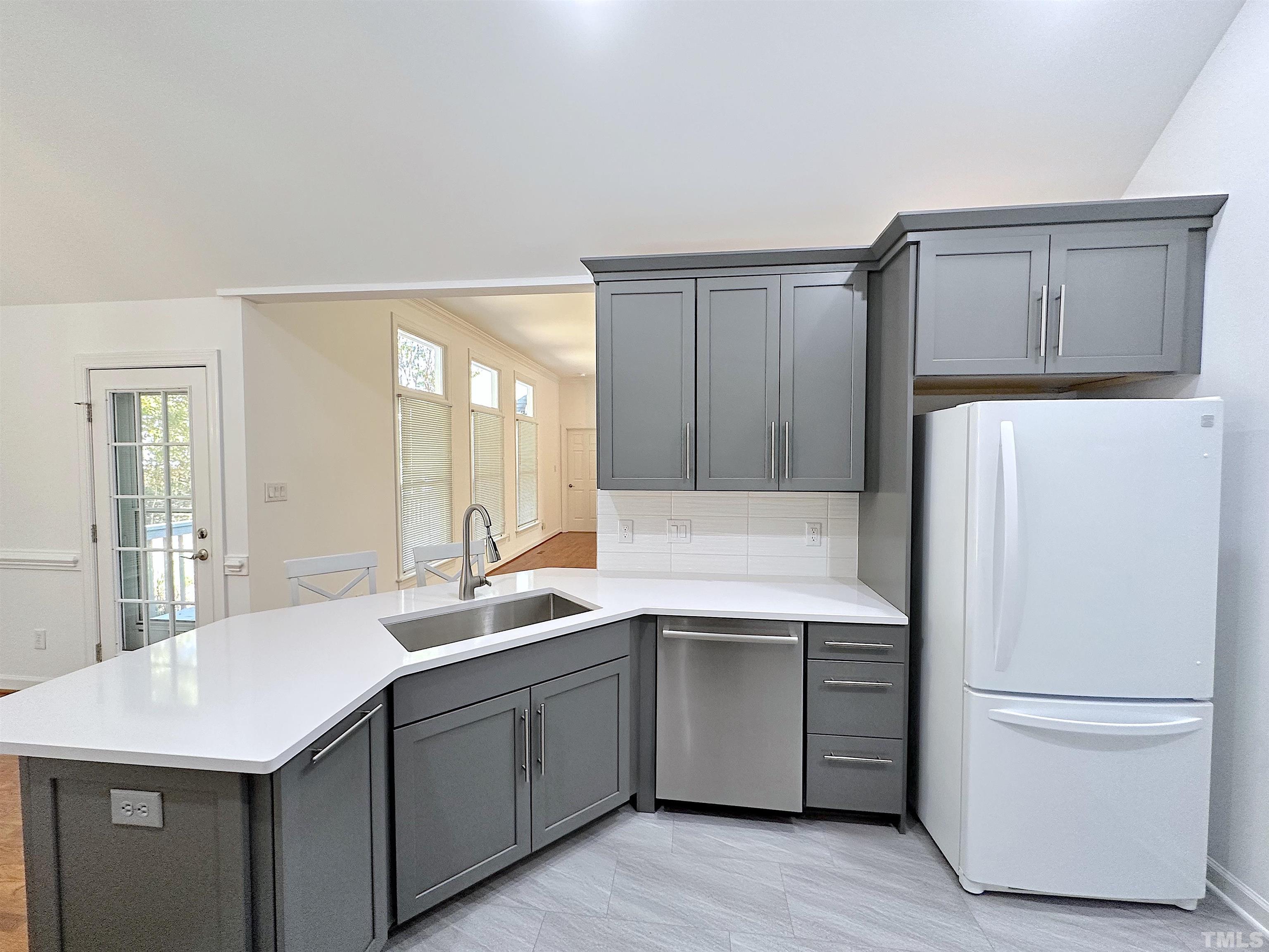 105 Wagon Trail Drive Cary, NC 27513 - Photo 8 of 22 a kitchen with a sink a stove and cabinets