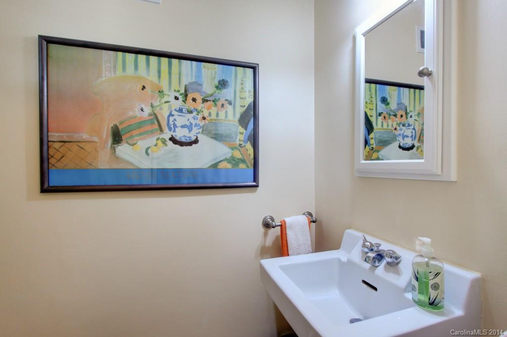 1133 Andover Road Charlotte, NC 28211 - Photo 14 of 24 a bathroom with a painting on the wall and a picture on the wall