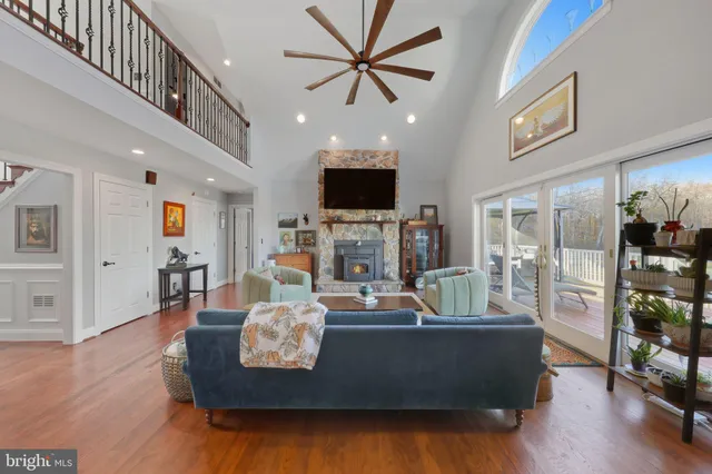 a living room with fireplace furniture and a flat screen tv