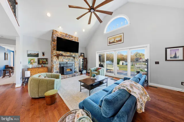 a living room with fireplace furniture and a flat screen tv