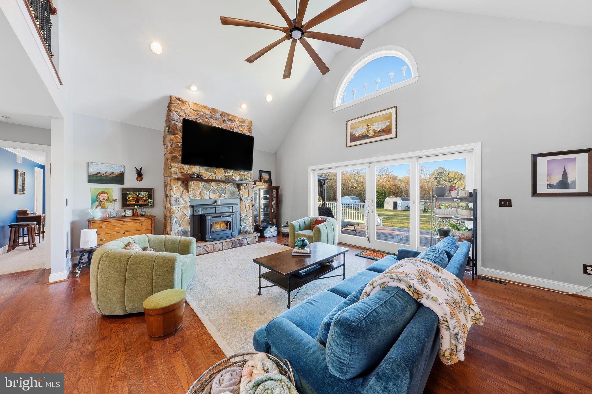121 Little Eagle Road Centreville, MD 21617 - Photo 13 of 64 a living room with fireplace furniture and a flat screen tv