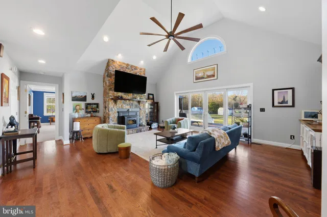 a living room with fireplace furniture and a flat screen tv