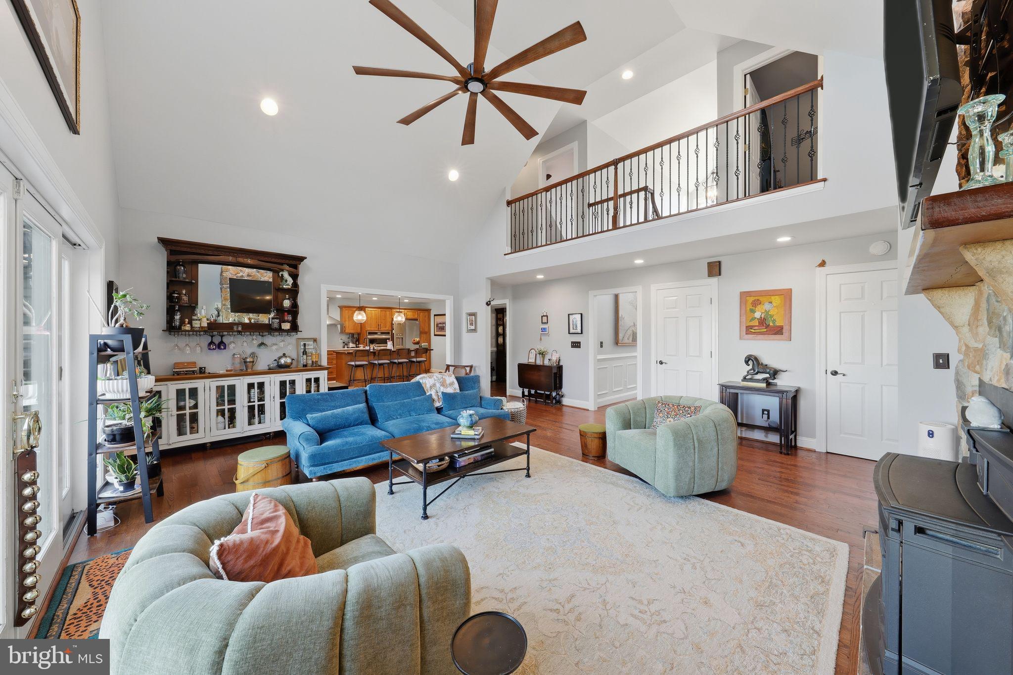 121 Little Eagle Road Centreville, MD 21617 - Photo 15 of 64 a living room with furniture a flat screen tv and kitchen view