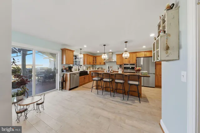 a kitchen with a table and chairs