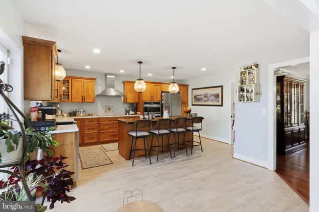 a kitchen with a table and chairs