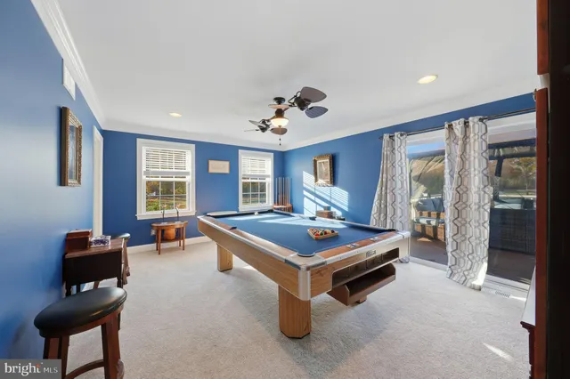 a room with furniture and air hockey table