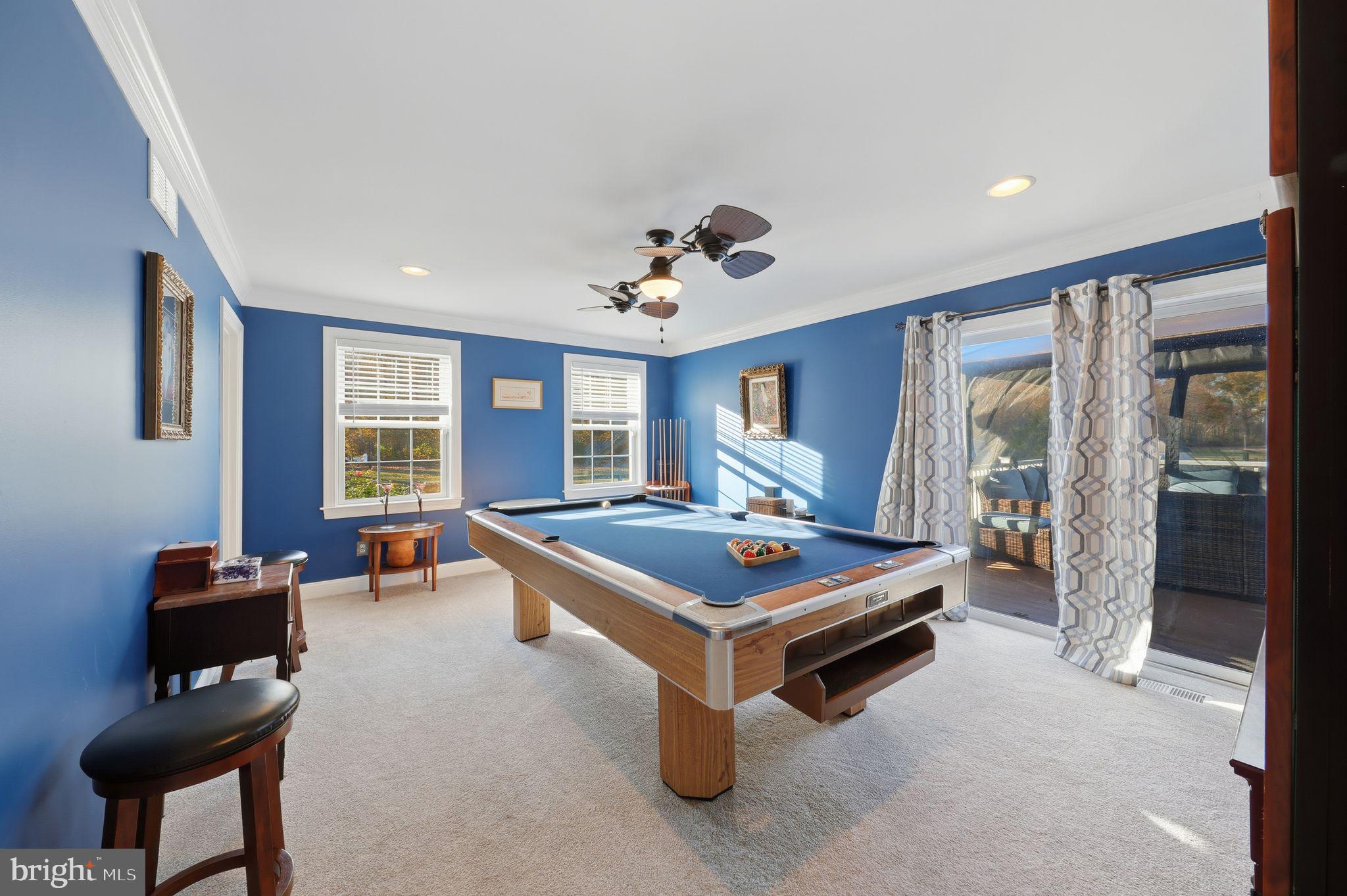 121 Little Eagle Road Centreville, MD 21617 - Photo 28 of 64 a living room with furniture pool table and a large window