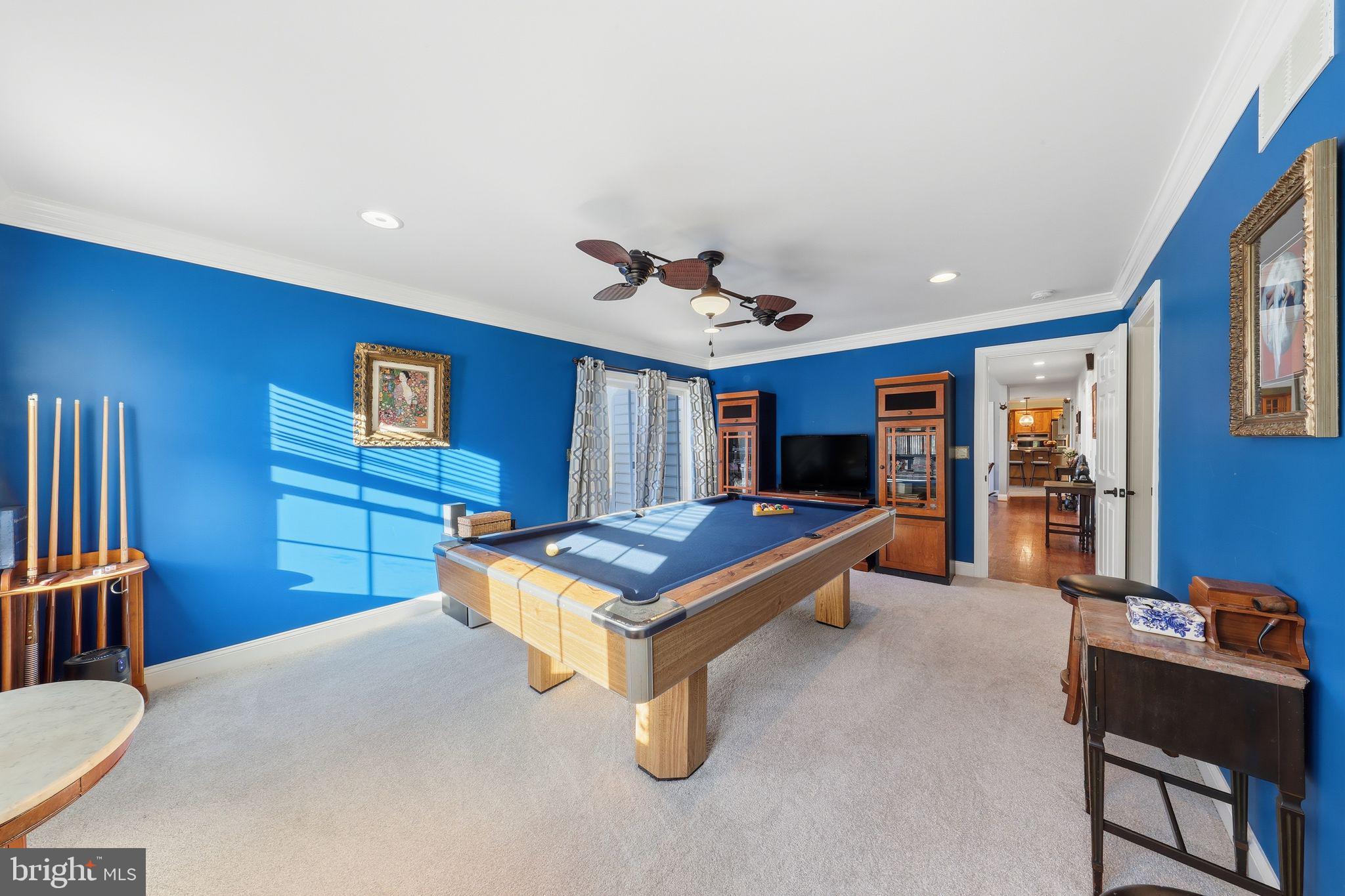 121 Little Eagle Road Centreville, MD 21617 - Photo 29 of 64 a room with furniture and air hockey table