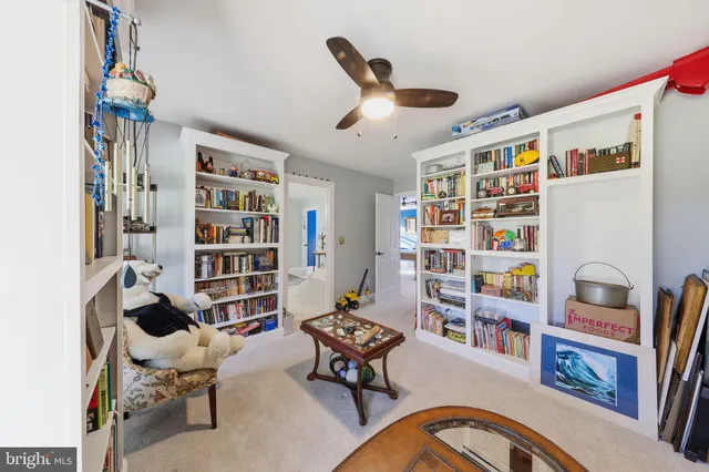 a living room with furniture and natural light