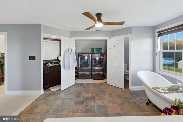 a view of a balcony with wooden floor and outdoor seating