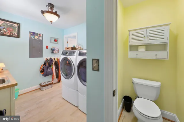 an aerial view of a house with swimming pool and a yard