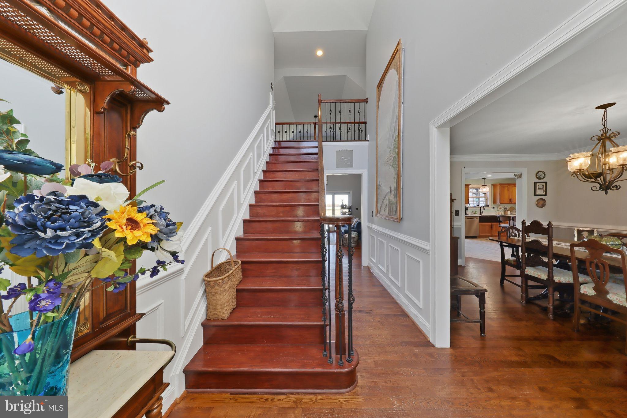 121 Little Eagle Road Centreville, MD 21617 - Photo 6 of 64 a view of entryway and hall with wooden floor