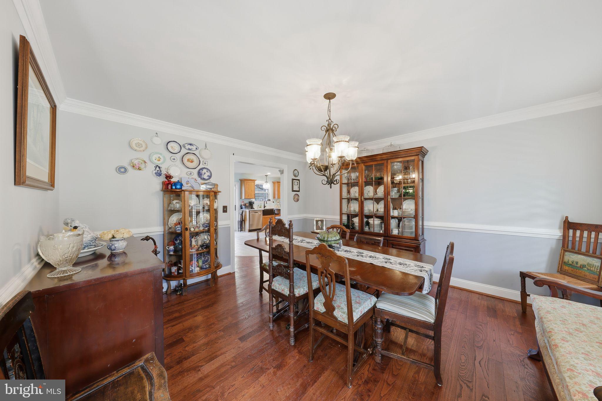 121 Little Eagle Road Centreville, MD 21617 - Photo 8 of 64 a view of a dining room with furniture and wooden floor