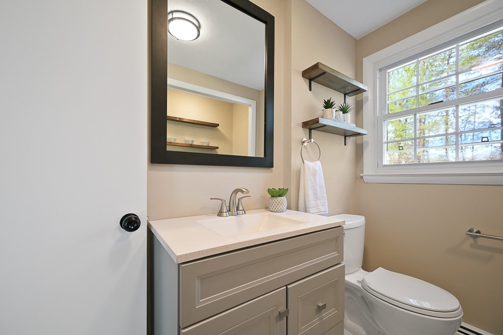 28 Hadley Road Sudbury, MA 01776 - Photo 14 of 30 a bathroom with a toilet sink and mirror