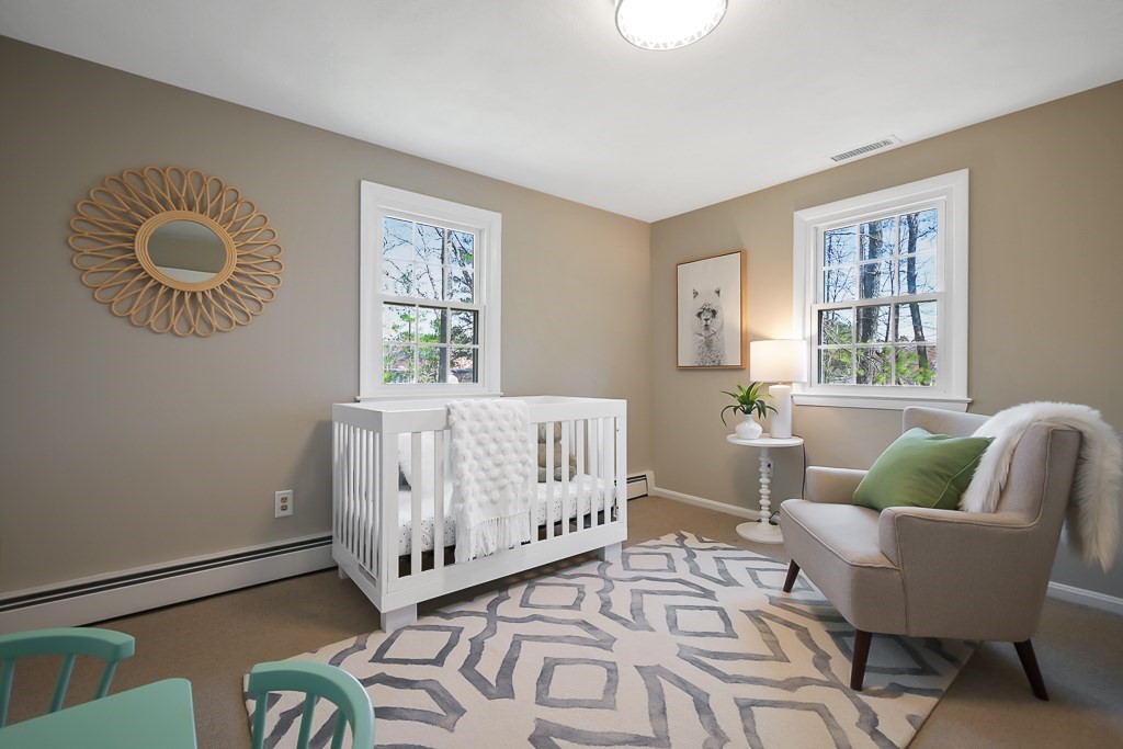 28 Hadley Road Sudbury, MA 01776 - Photo 19 of 30 a bedroom with furniture and a window