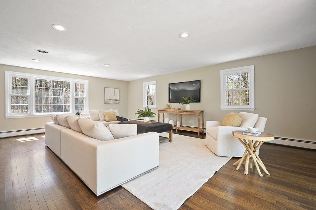 28 Hadley Road Sudbury, MA 01776 - Photo 4 of 30 a living room with furniture wooden floor and a flat screen tv