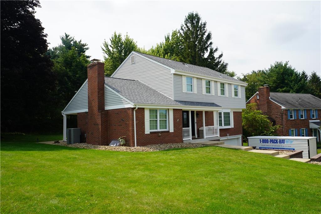8372 Post Road Allison Park, PA 15101 - Photo 3 of 9 a front view of a house with a yard and green space