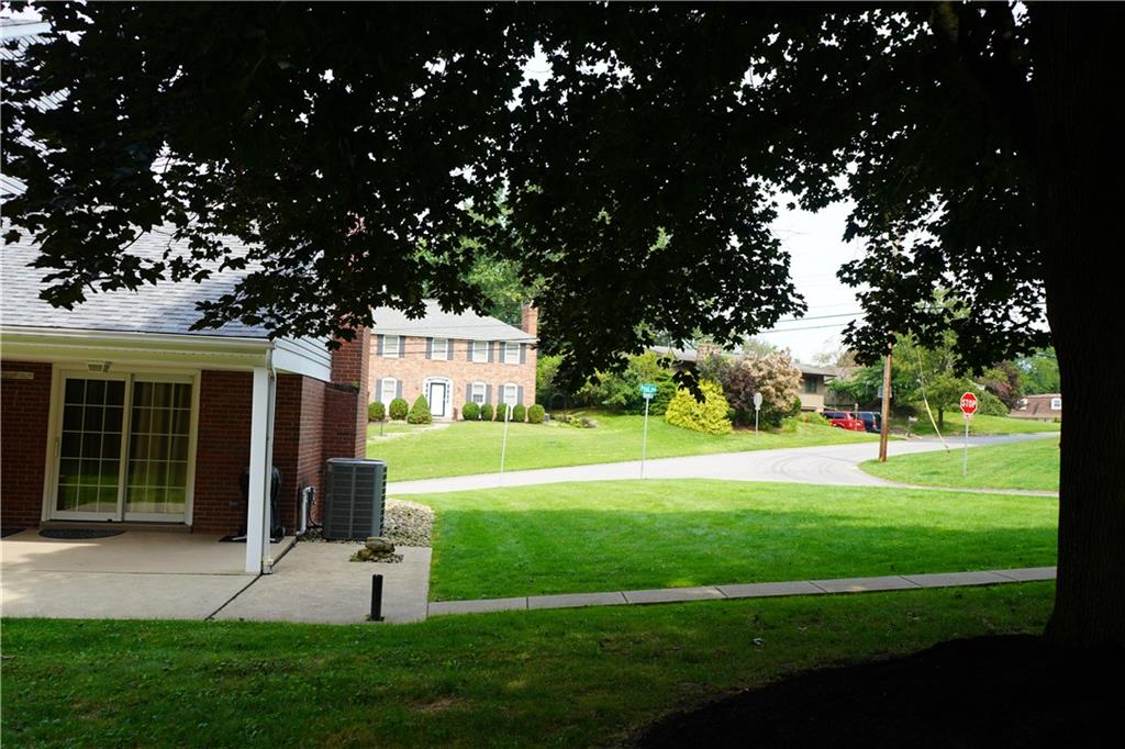 8372 Post Road Allison Park, PA 15101 - Photo 4 of 9 a view of a house with a big yard potted plants and large tree