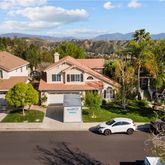 an aerial view of a house with a garden space