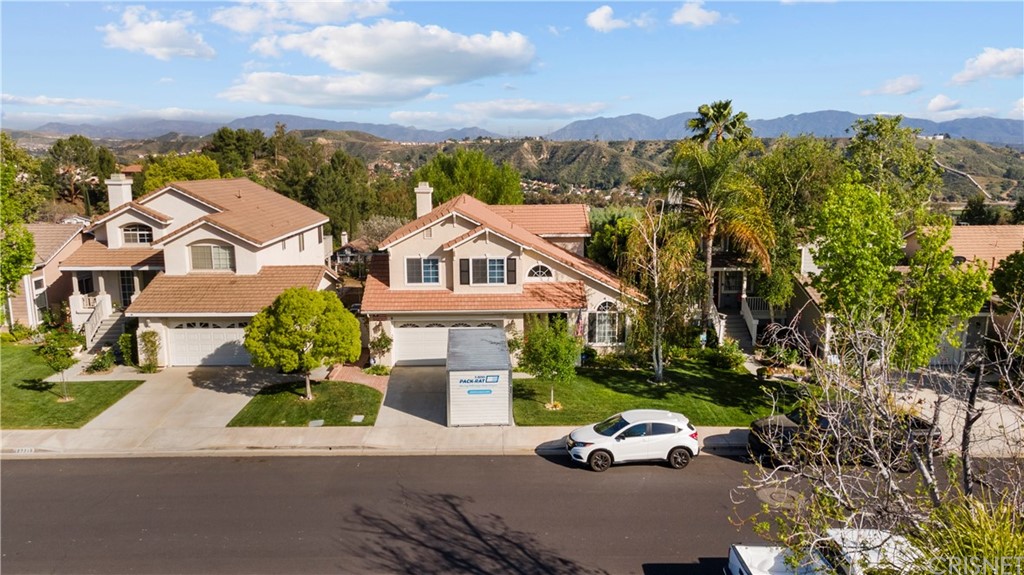 an aerial view of a house with a garden space