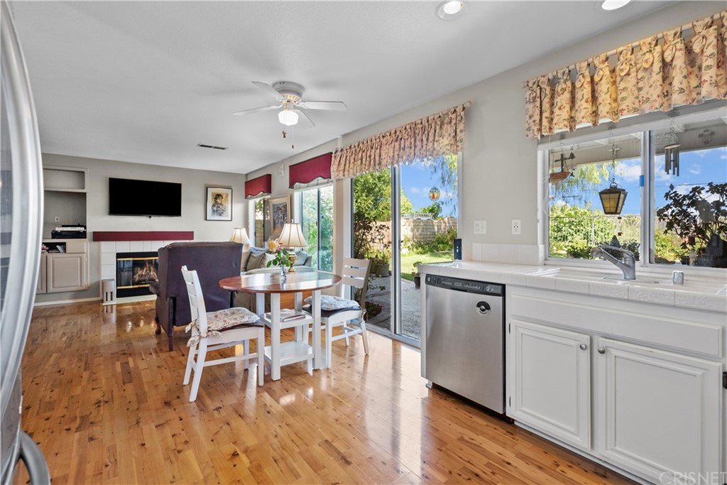 27710 Kristin Lane Saugus, CA 91350 - Photo 18 of 32 a dining room with furniture a flat screen tv and large windows