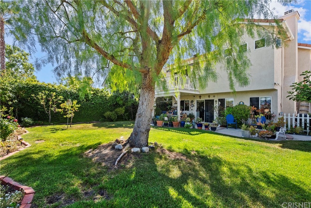 27710 Kristin Lane Saugus, CA 91350 - Photo 21 of 32 a view of a swimming pool with a patio and a yard