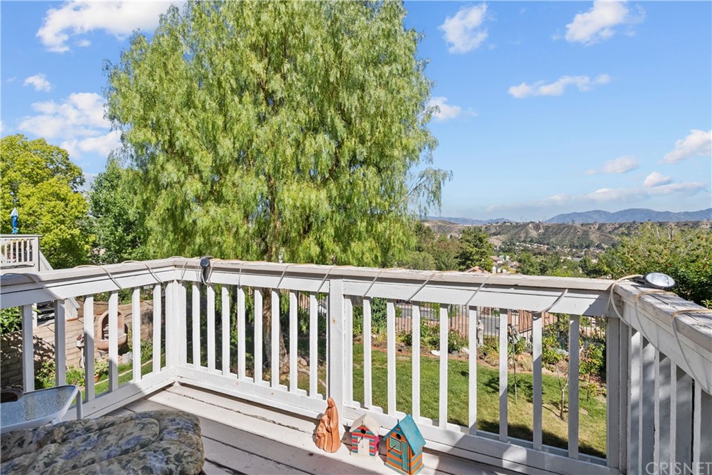 27710 Kristin Lane Saugus, CA 91350 - Photo 27 of 32 a view of a wooden deck next to a yard