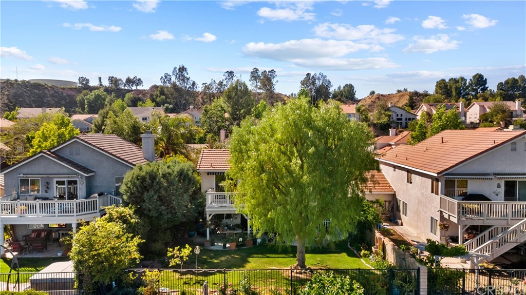 27710 Kristin Lane Saugus, CA 91350 - Photo 4 of 32 aerial view of a house with a yard and plants