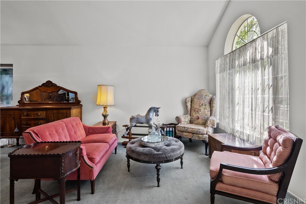 27710 Kristin Lane Saugus, CA 91350 - Photo 6 of 32 a living room with furniture a rug and a window