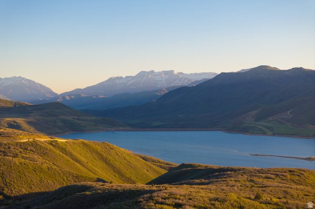 1737 East Viewside Circle Hideout, UT 84036 - Photo 35 of 35 Expansive mountain landscape featuring a large body of water, rolling hills with varied foliage, and distant snow-capped peaks under a clear sky