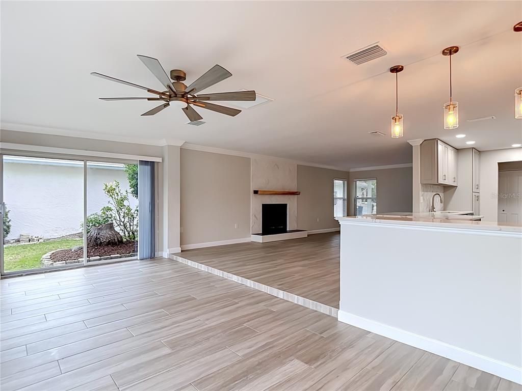 4536 Mitcher Road New Port Richey, FL 34652 - Photo 35 of 46 a view of a kitchen with a dishwasher and wooden floor