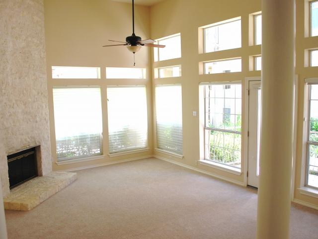 2918 Ranch Road 620, Unit 172 Austin, TX 78734 - Photo 5 of 18 an empty room with windows and closet