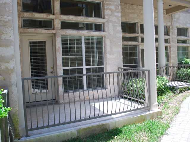2918 Ranch Road 620, Unit 172 Austin, TX 78734 - Photo 10 of 18 a view of a house with a large window and wooden fence