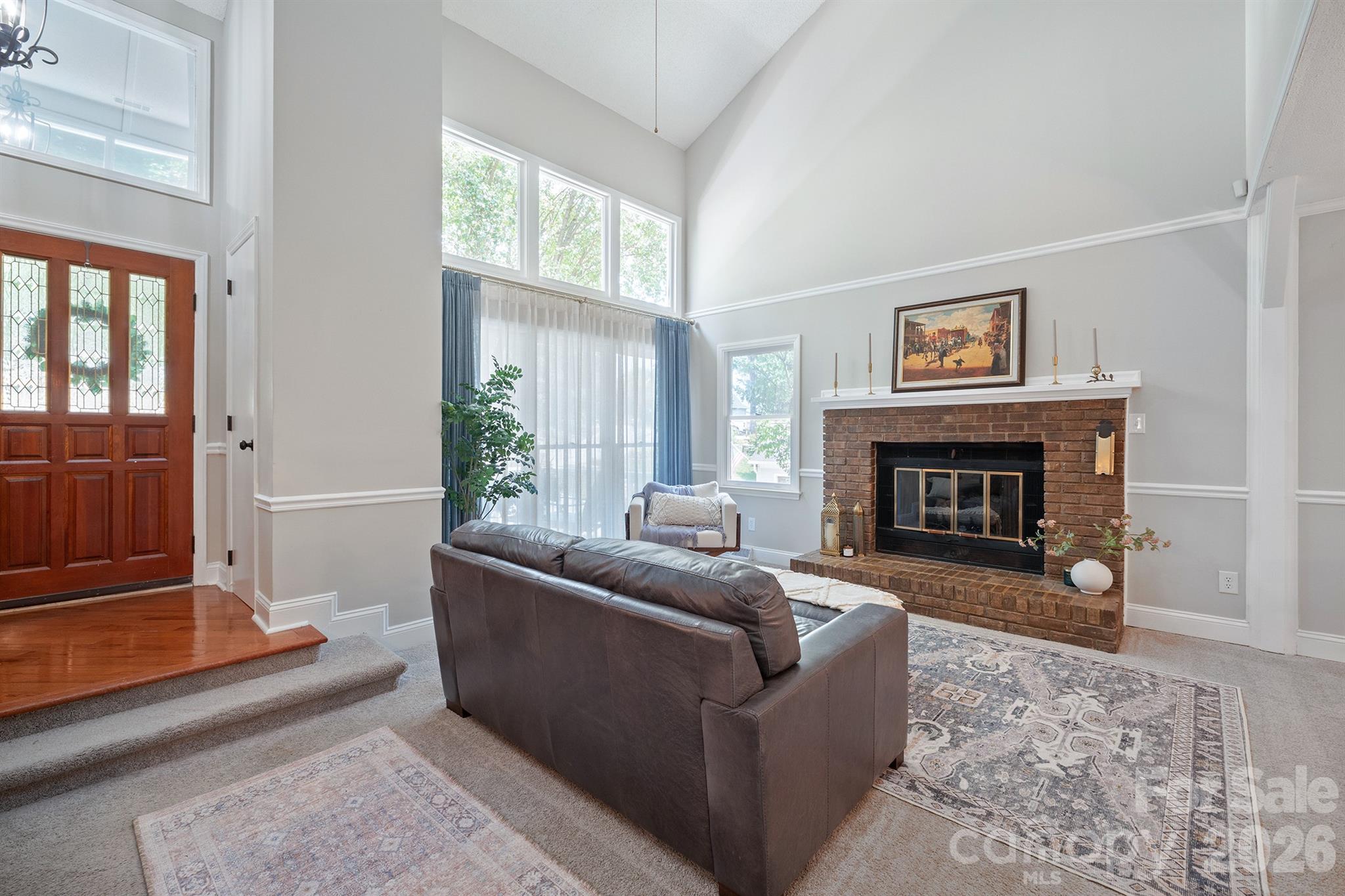 19017 Kailua Circle Tega Cay, SC 29708 - Photo 8 of 46 a living room with furniture and a fireplace