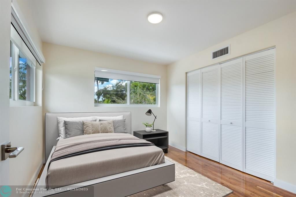 1001 Northeast 80th Street, Unit 4 Miami, FL 33138 - Photo 14 of 27 a bedroom with a bed and a window