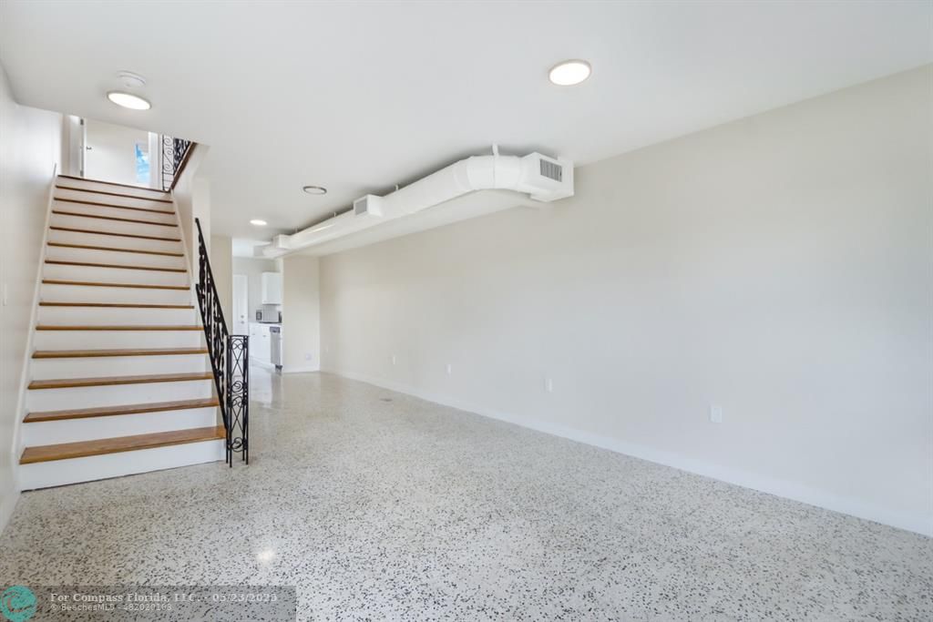 1001 Northeast 80th Street, Unit 4 Miami, FL 33138 - Photo 20 of 27 a view of a hallway with stairs
