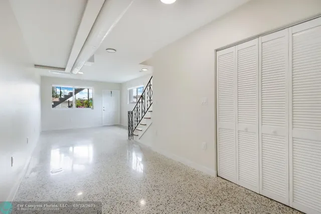 a view of empty room with windows