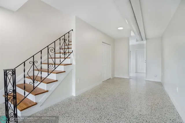 a view of an entryway with wooden floor