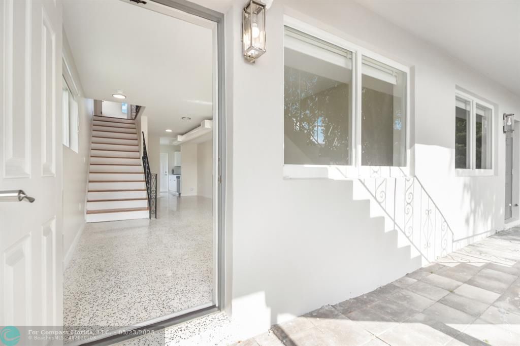 1001 Northeast 80th Street, Unit 4 Miami, FL 33138 - Photo 4 of 27 a view of a hallway view with staircase