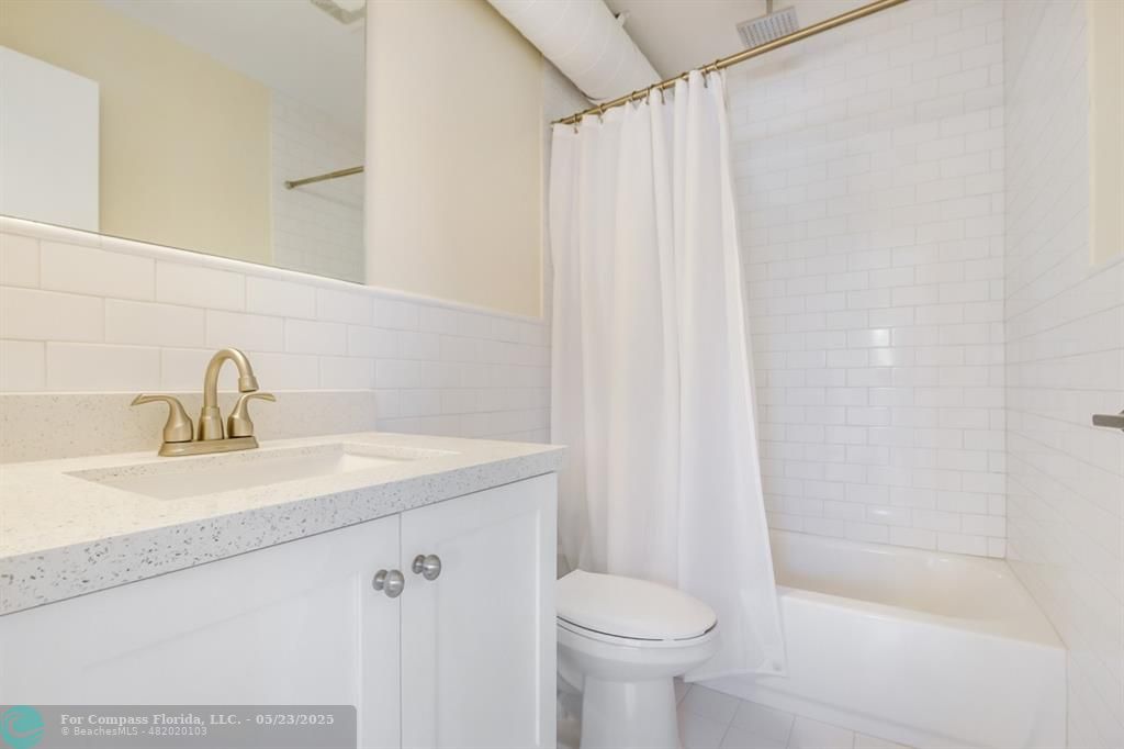 1001 Northeast 80th Street, Unit 4 Miami, FL 33138 - Photo 9 of 27 a bathroom with a sink a toilet and shower