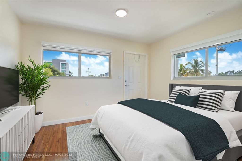 1001 Northeast 80th Street, Unit 4 Miami, FL 33138 - Photo 10 of 27 a bedroom with a large bed and a window
