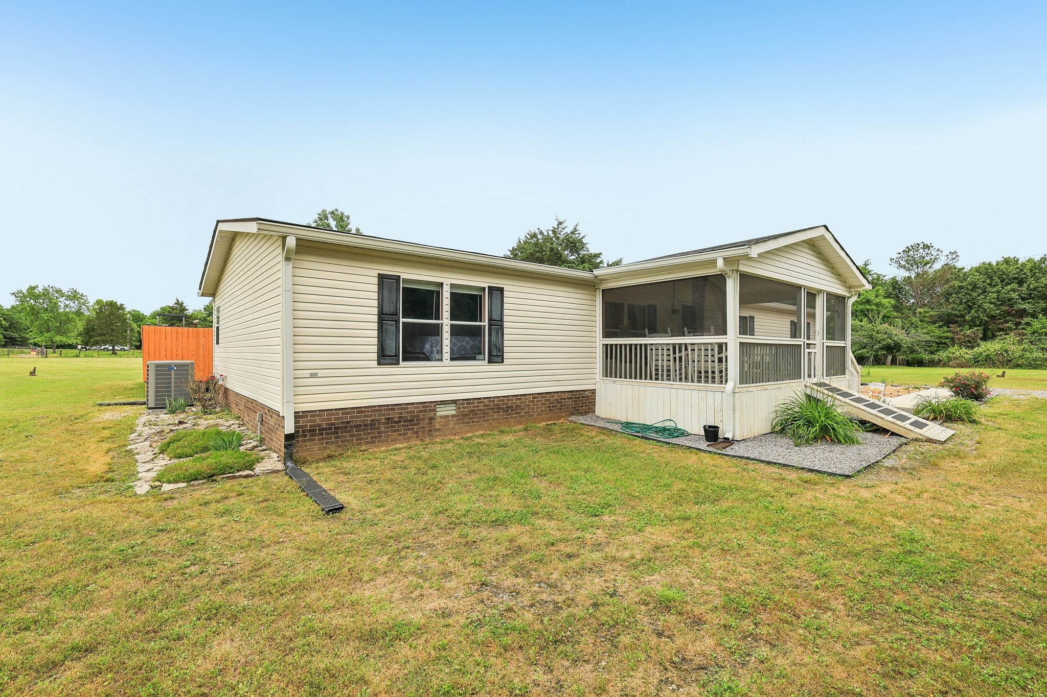 12056 Newtown Road Rockvale, TN 37153 - Photo 5 of 65 a view of a house with a yard and sitting area